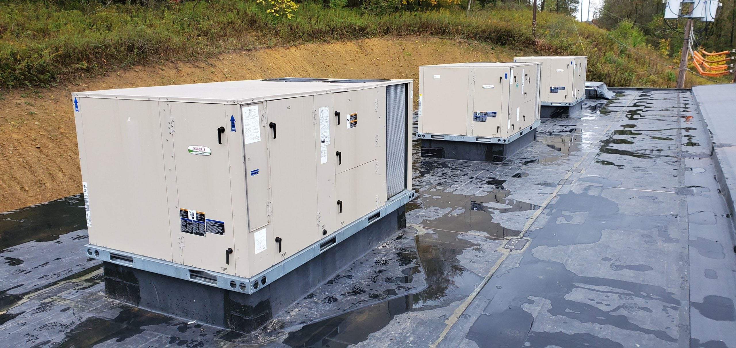 HVAC technician from Temperature Control Services LLC working on a commercial HVAC unit in Western Pennsylvania
